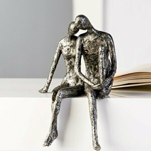 Escultura „Couple“, sentados en el canto